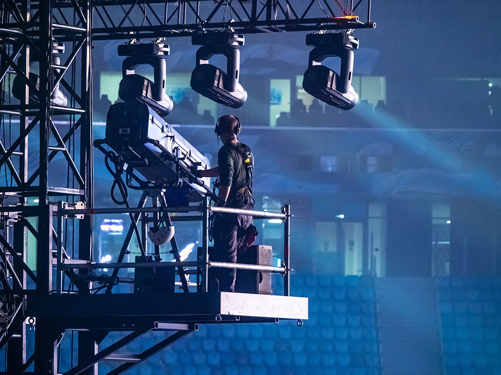 A man controls the lighting equipment. Checking stage equipment.